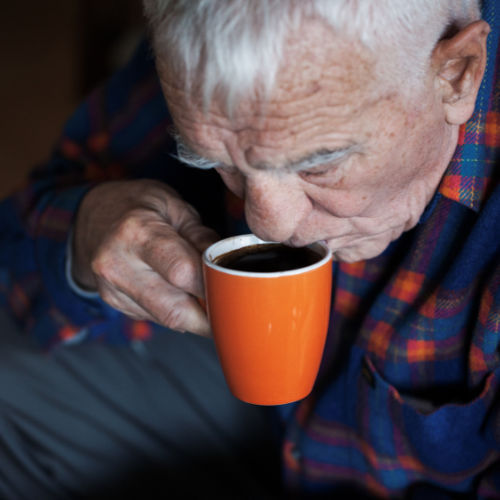 old man drinking coffee